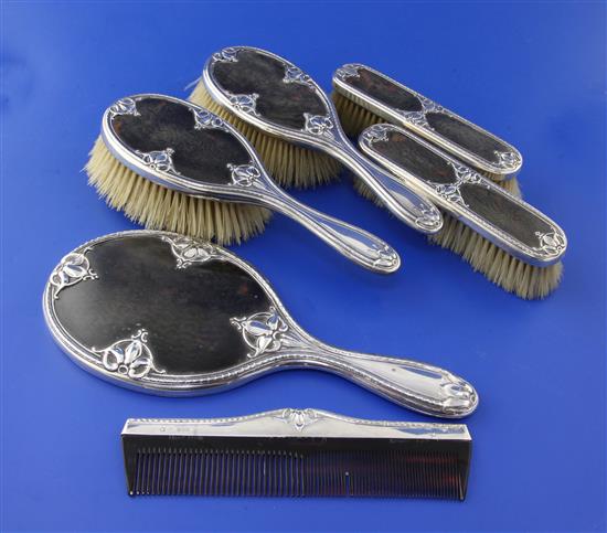 An Edwardian and later silver and tortoiseshell mounted six piece dressing table set,